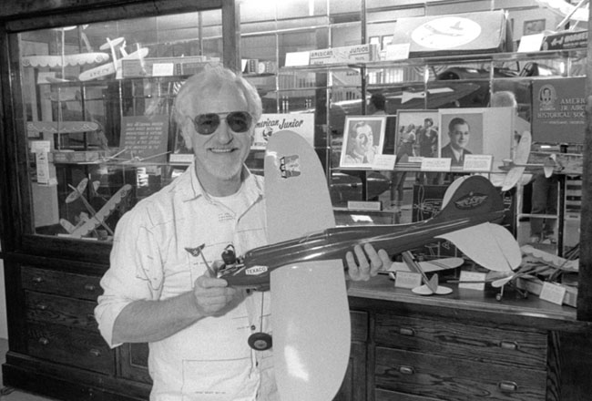 Frank Macy holding Fireball at the Pierson Airport American Junior display